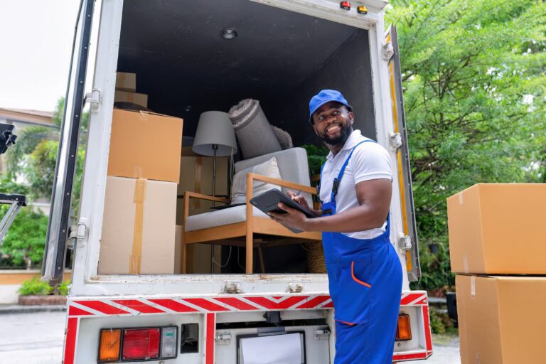 mover works on removing items from moving truck